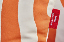 Load image into Gallery viewer, Close-up of a striped fabric with a visible brand tag.