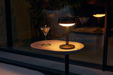 Load image into Gallery viewer, Anthracite Fatboy Bellboy Lamp on a Brick Table at Night