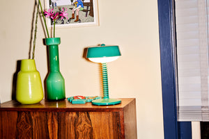 Jungle Green Fatboy Bellboy Lamp on a Cabinet