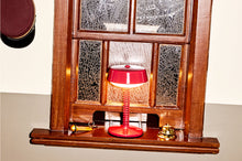Load image into Gallery viewer, Lobby Red Fatboy Bellboy Lamp at a Ticket Counter