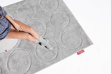 Load image into Gallery viewer, Girl Sitting on a Point Pouf on a Cloudy Grey Fatboy Dot Carpet