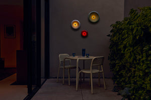 Lobby Red Fatboy Oloha Small Hanging on a Patio Wall at Night
