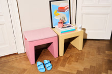 Load image into Gallery viewer, Candy and Spark Fatboy Concrete Seats in a Room Next to a Wall
