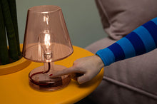 Load image into Gallery viewer, Brown Fatboy Transloetje Lamp Being Turned On