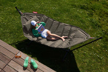 Load image into Gallery viewer, Model Laying on a Taupe Fatboy Headdemock Hammock Reading a Book
