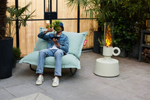 Load image into Gallery viewer, Guy Sitting on a Fatboy Original Outdoor Rock 'n Roll Rocker