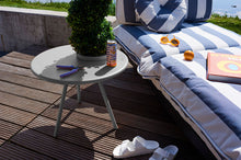 Load image into Gallery viewer, Light Grey Fatboy Bakkes Side Table Next to a Paletti Lounge