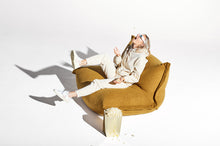 Load image into Gallery viewer, Model Sitting on a Cider Fatboy BonBaron Sherpa Eating Popcorn