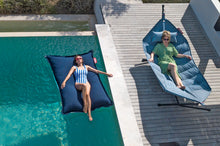 Load image into Gallery viewer, Model Laying on a Dark Ocean Fatboy Floatzac in a Pool