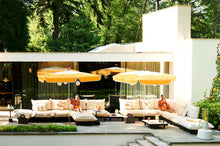 Load image into Gallery viewer, Sahara Fatboy Paletti Lounges on a Pool Deck