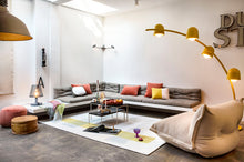 Load image into Gallery viewer, Rhubarb Fatboy Point Recycled Velvet Ottoman in a Room Next to a Couch