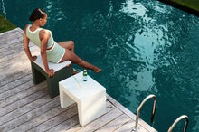 Load image into Gallery viewer, Model Sitting on a Fatboy Concrete Seat by the Pool
