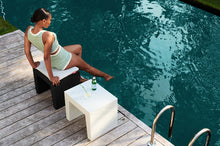 Load image into Gallery viewer, White Fatboy Concrete Seat Used as a Side Table by the Water
