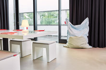 Load image into Gallery viewer, White Fatboy Concrete Seats Around a Conference Table