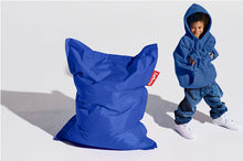Load image into Gallery viewer, Boy Standing Next to a Petrol Fatboy Junior Bean Bag Chair

