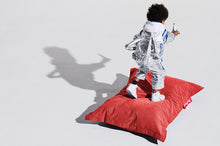 Load image into Gallery viewer, Boy Standing on a Red Fatboy Junior Stonewashed Bean Bag Chair
