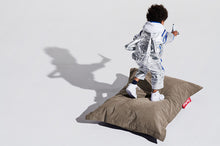 Load image into Gallery viewer, Boy Standing on a Taupe Fatboy Junior Stonewashed Bean Bag Chair
