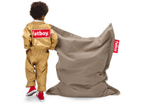 Load image into Gallery viewer, Boy Standing Next to a Taupe Fatboy Junior Stonewashed Bean Bag Chair