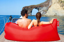 Load image into Gallery viewer, Couple Sitting on a Red Fatboy Lamzac the Original on a Boat Deck