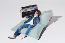 Load image into Gallery viewer, Guy Laying on a Seafoam Fatboy Original Outdoor Bean Bag