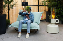 Load image into Gallery viewer, Guy Sitting on a Seafoam Fatboy Original Outdoor Bean Bag with a Rock 'n Roll Rocker