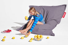 Load image into Gallery viewer, Girl Sitting on a Grey Fatboy Original Stonewashed Bean Bag