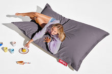 Load image into Gallery viewer, Girl Laying on a Grey Fatboy Original Stonewashed Bean Bag