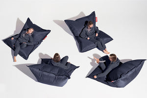 Girl Sitting on a Blue Fatboy Original Slim Nylon Bean Bag in Different Positions