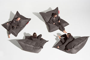 Girl Sitting on a Dark Grey Fatboy Bean Bag in Different Positions