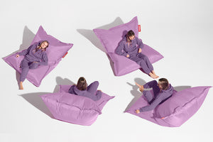 Girl Sitting on a Lilac Fatboy Bean Bag in Different Positions