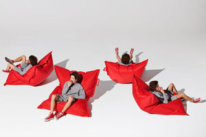 Guy Sitting on a Red Fatboy Original Slim Bean Bag Chair in Different Positions
