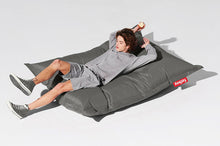 Load image into Gallery viewer, Guy Laying on a Silver Fatboy Original Bean Bag