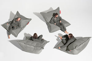 Girl Sitting on a Silver Fatboy Original Slim Nylon Bean Bag in Different Positions