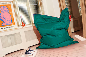 Turquoise Fatboy Original Slim Bean Bag Chair in a Room