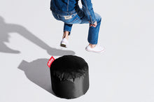 Load image into Gallery viewer, Model with a Black Fatboy Point Ottoman