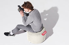 Load image into Gallery viewer, Guy Sitting on a Silver Grey Fatboy Point Stonewashed Pouf