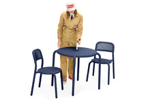 Load image into Gallery viewer, Model Standing Next to a Dark Ocean Fatboy Toni Bistreau with Toni Chairs
