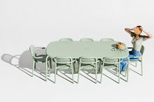 Load image into Gallery viewer, Model Sitting at a Mist Green Fatboy Toni Tablo with Toni Armchairs
