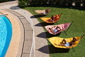 Fatboy Headdemock Hammocks on a Lawn by the Pool