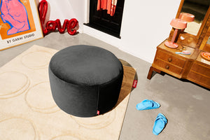 Cave Fatboy Point Large Recycled Royal Velvet Pouf Sitting in a Room on a Rug