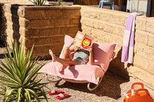 Load image into Gallery viewer, Girl Sitting on a Fatboy Original Outdoor Rock &#39;n Roll Rocker Reading a Book

