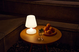 Sunbeam Fatboy Bakkes Table with a Edison the Petit Lamp at Night