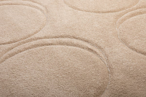 Closeup of a Creamy Camel Fatboy Dot Carpet
