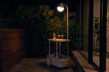 Load image into Gallery viewer, Light Grey Fatboy Jolly Trolley on a Patio at Night
