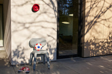 Load image into Gallery viewer, Lobby Red Fatboy Oloha Small Hanging on the Side of a House
