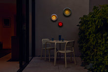 Load image into Gallery viewer, Multi Fatboy Oloha Trio Hanging on a Patio Wall at Night
