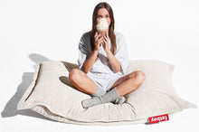 Load image into Gallery viewer, Girl Sitting on a Cream Fatboy Slim Cord Bean Bag

