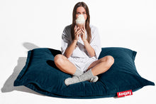 Load image into Gallery viewer, Girl Sitting on a Deep Blue Fatboy Slim Cord Bean Bag
