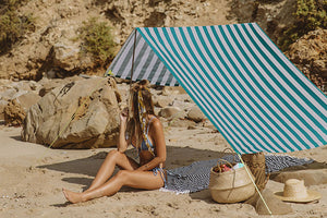 Girl Laying Under an Azur Fatboy Miasun Sun Shade on the Beach
