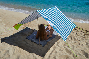 Girl Laying Under an Azur Fatboy Miasun Sun Shade on the Beach